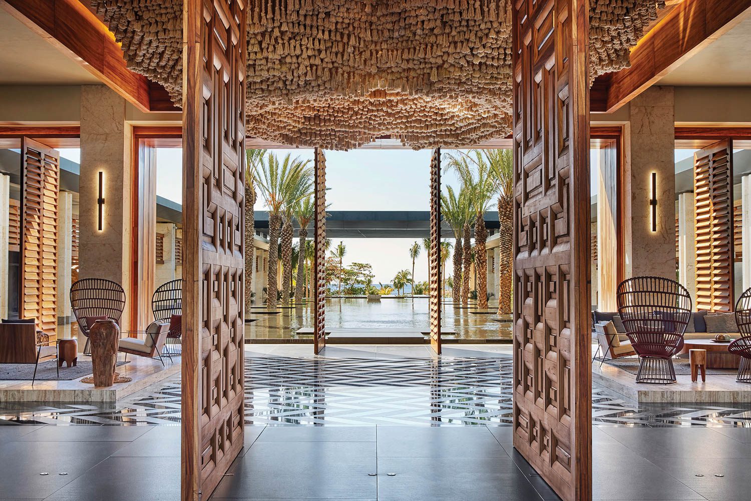 the lobby's pivoting-shutter walls and rope ceiling