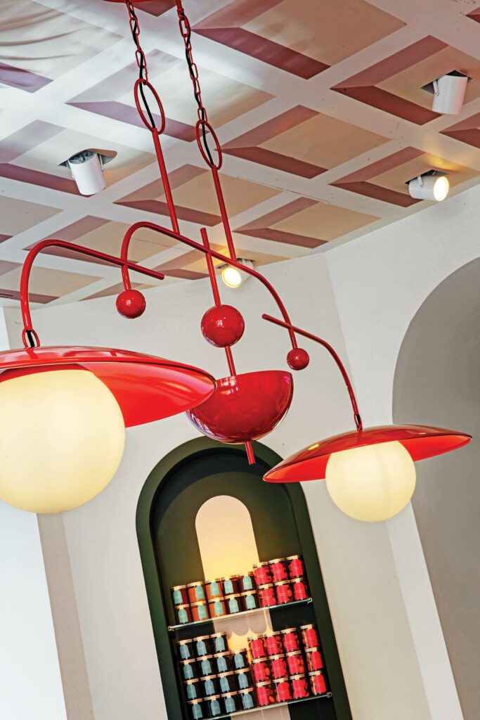 A custom powder-coated pendant fixture in Zucchero, the hotel’s café.