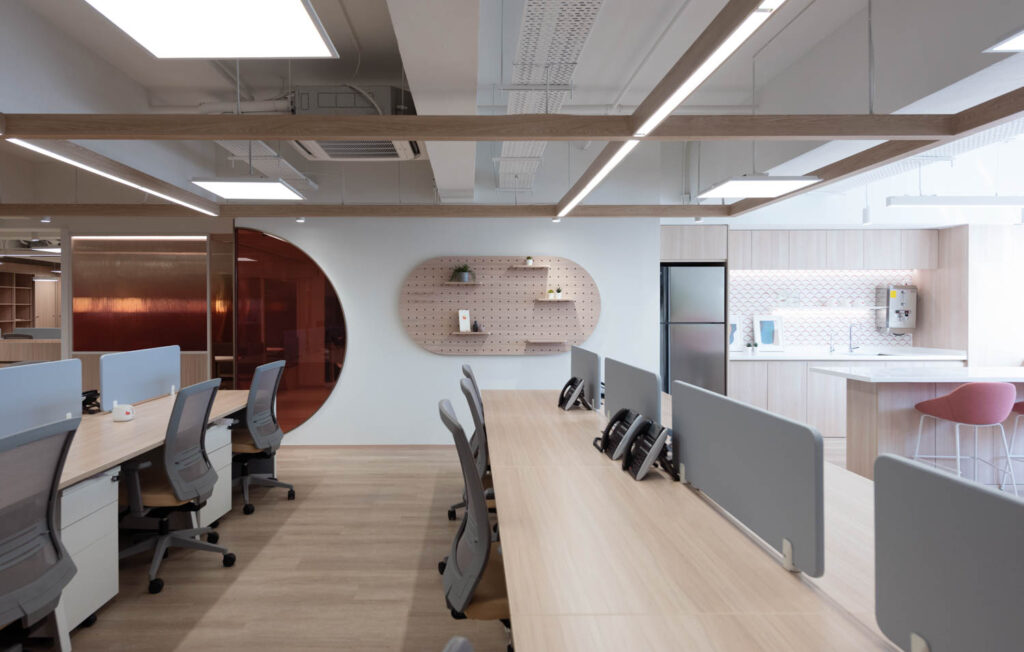 an open work area with a pegboard wall