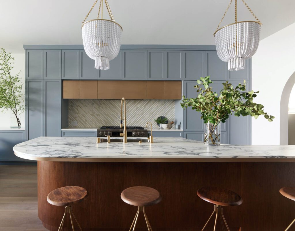 The kitchen island's curves play into the circular geometry throughout the home.