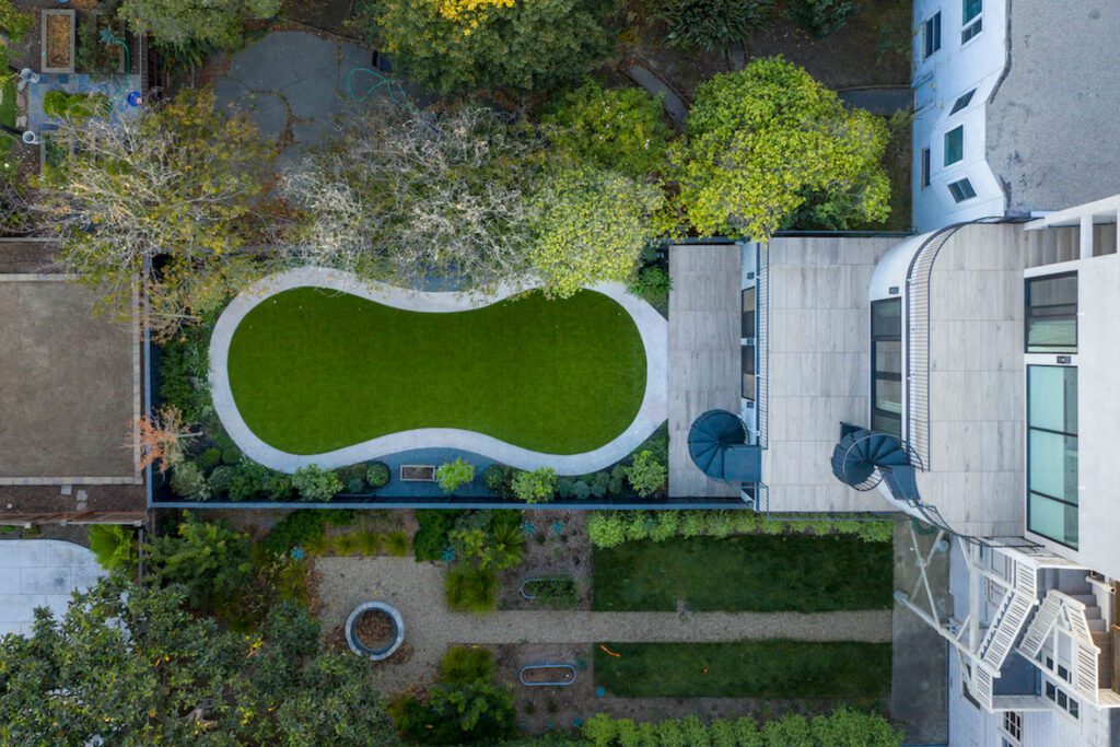 An aerial view of the home's curving backyard.