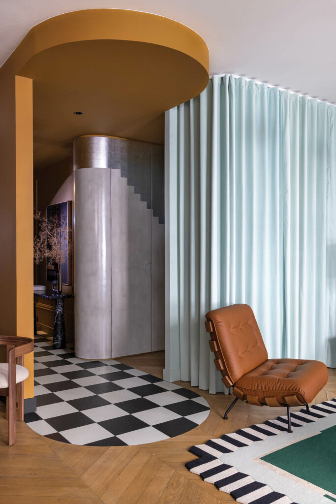 the entryway of a French apartment with checkerboard flooring