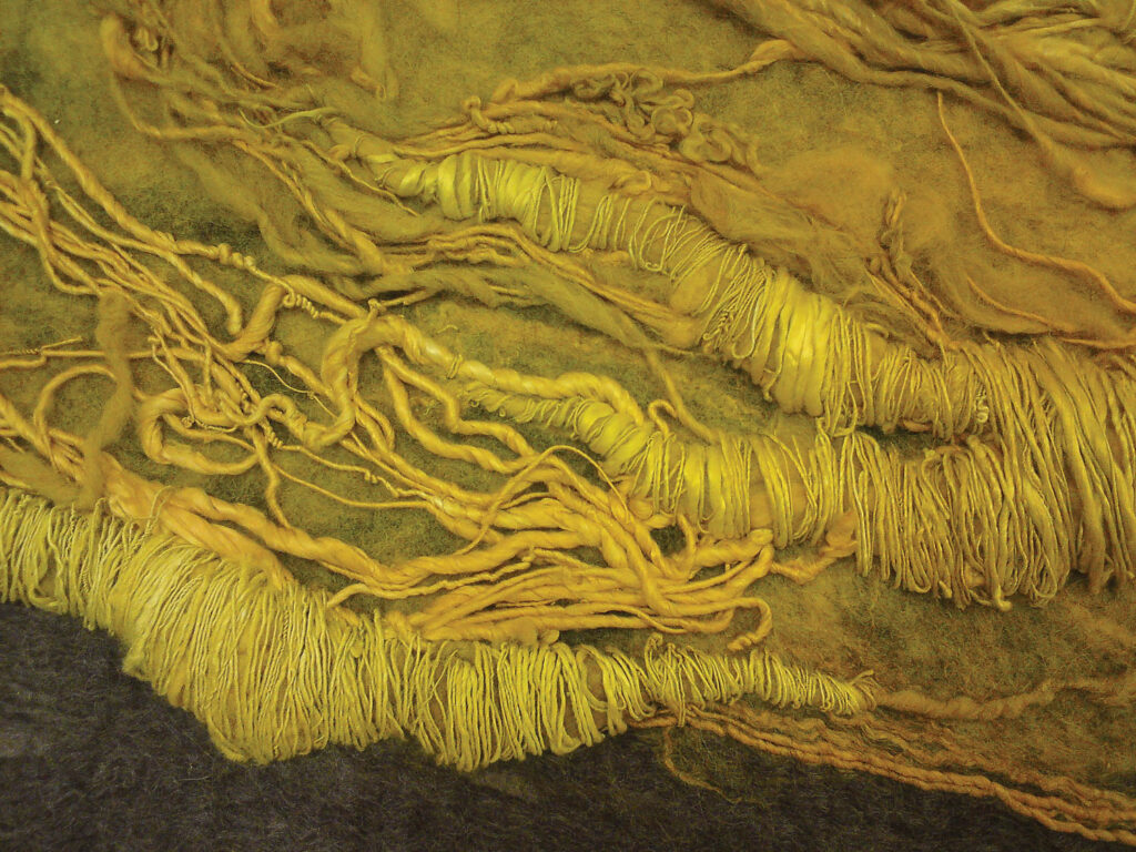 A closeup detail of the yellow textiles in Claudy Jongstra's untitled 2011 installation at Lincoln Center