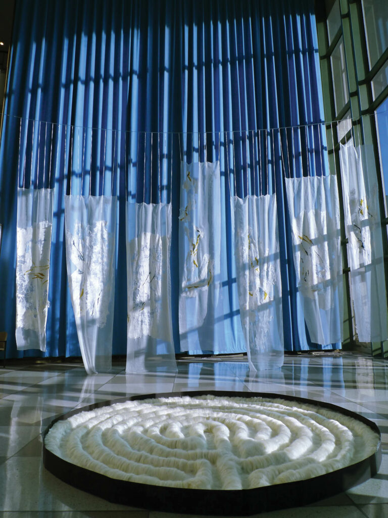 A white maze like collection of textiles as part of an un­titled 2011 work by Claudy Jongstra