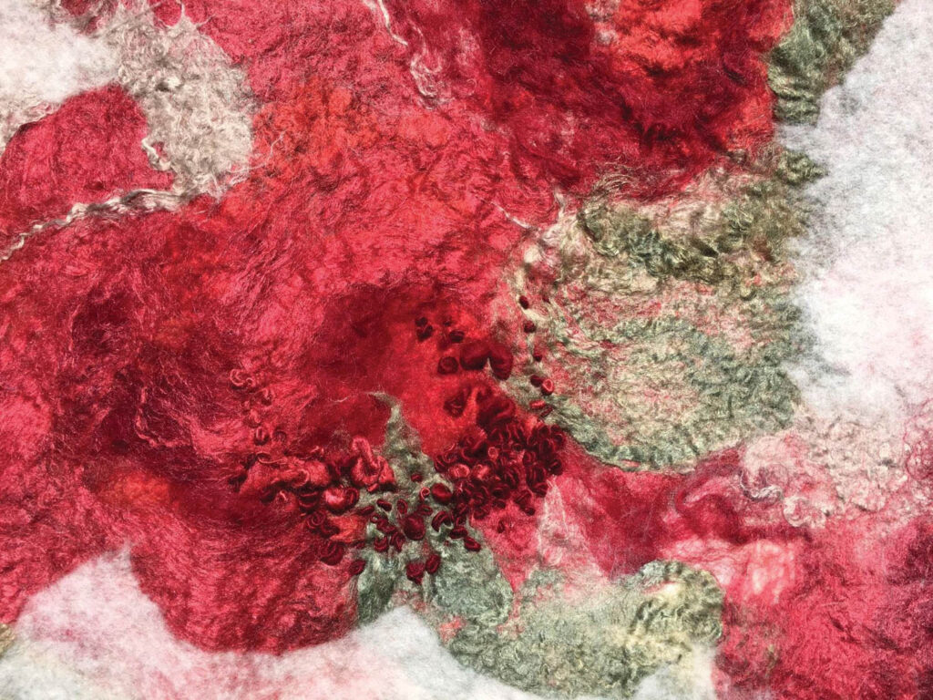 Pink wool is seen in a closeup detail of Priona Blossom, 2016