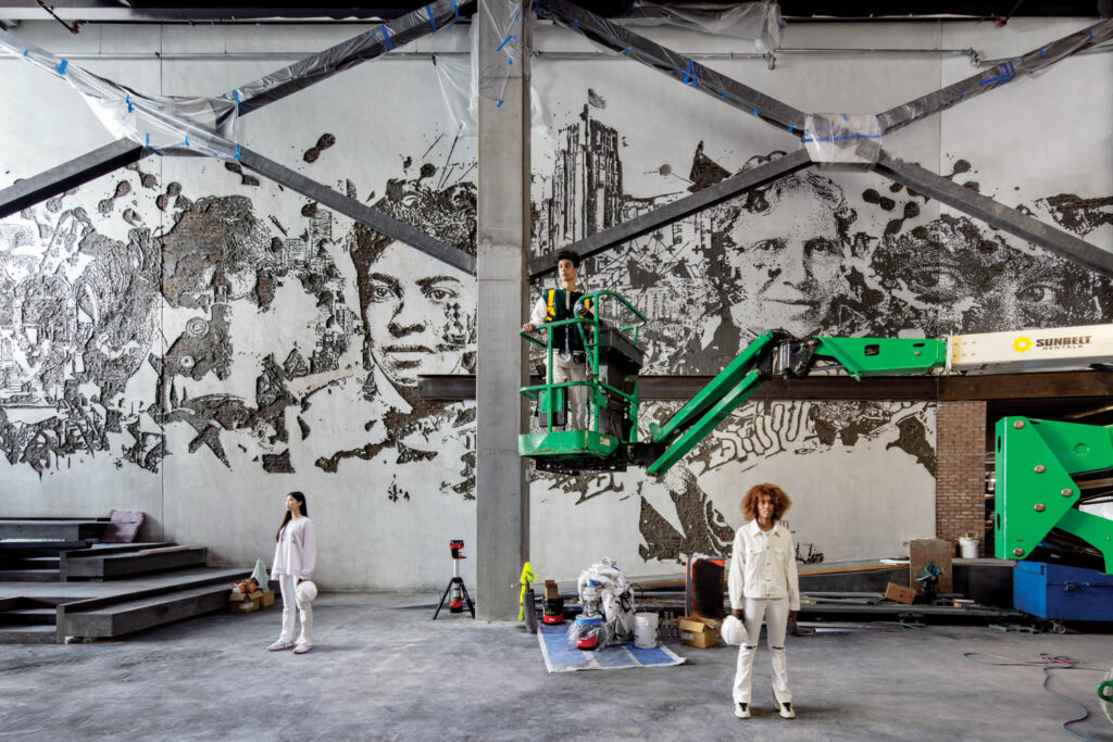 a 150-foot-long mural by Alex­andre Farto, aka Vhils, carved into plaster of notable women in science