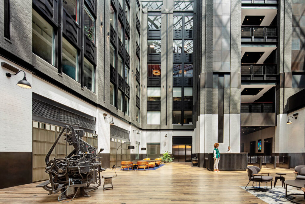 maple flooring in the middle of the lobby surrounded by offices