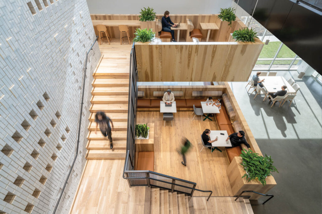 someone walks down the stairs toward the lobby at the LinkedIn office in Nebraska