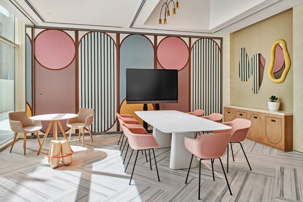 a long table in front of colorful acoustical fabric