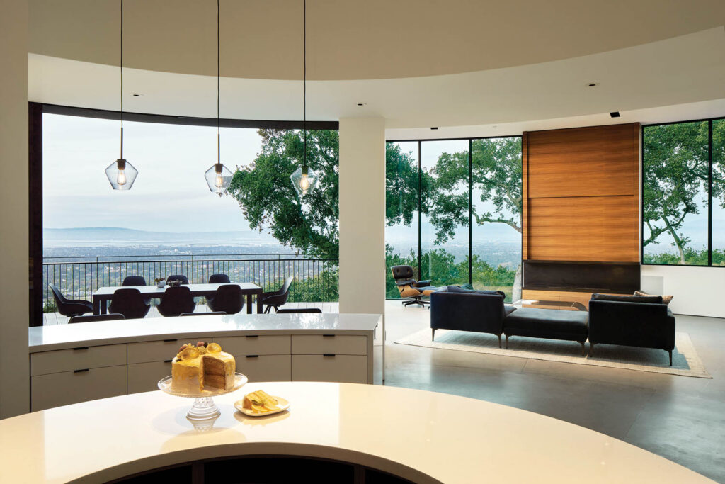 looking out from a kitchen onto an open patio with California mountains in the background