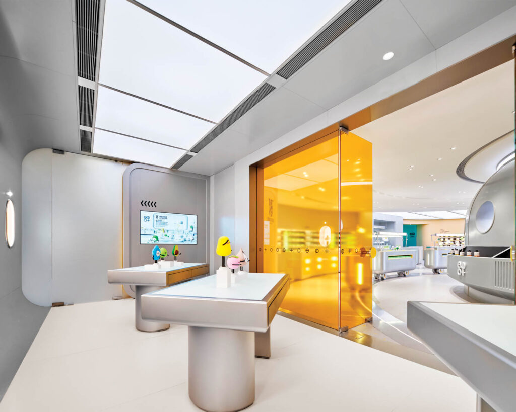 tinted yellow-glass walls and stainless-steel tables topped with cartoon figurines create an inviting atmosphere