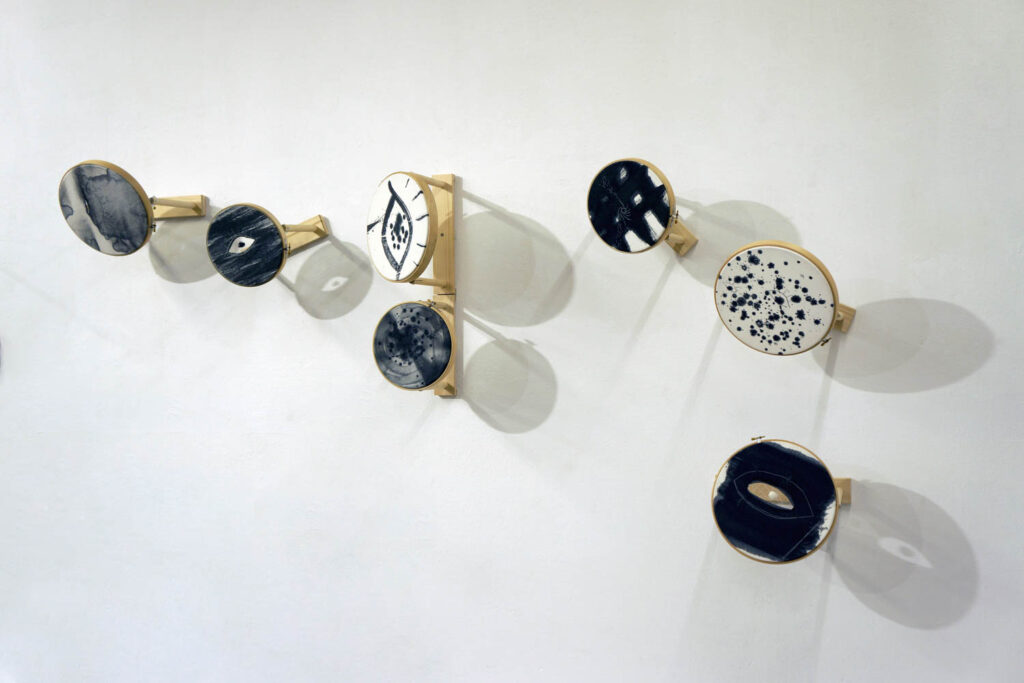 wall mounted embroidery hoops with eye motifs