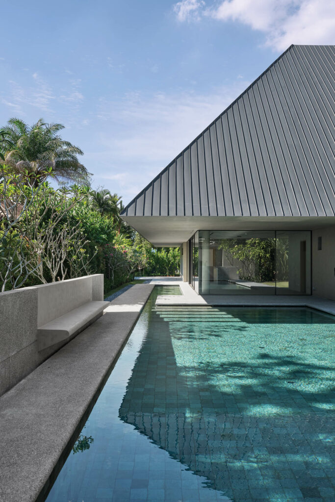 Greenery surrounds the tile-lined pool in the Siheyuan build