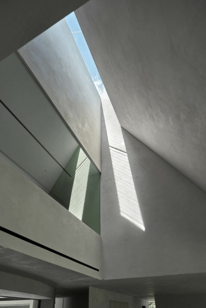 The homes geometries enable sunlight to stream down into the space