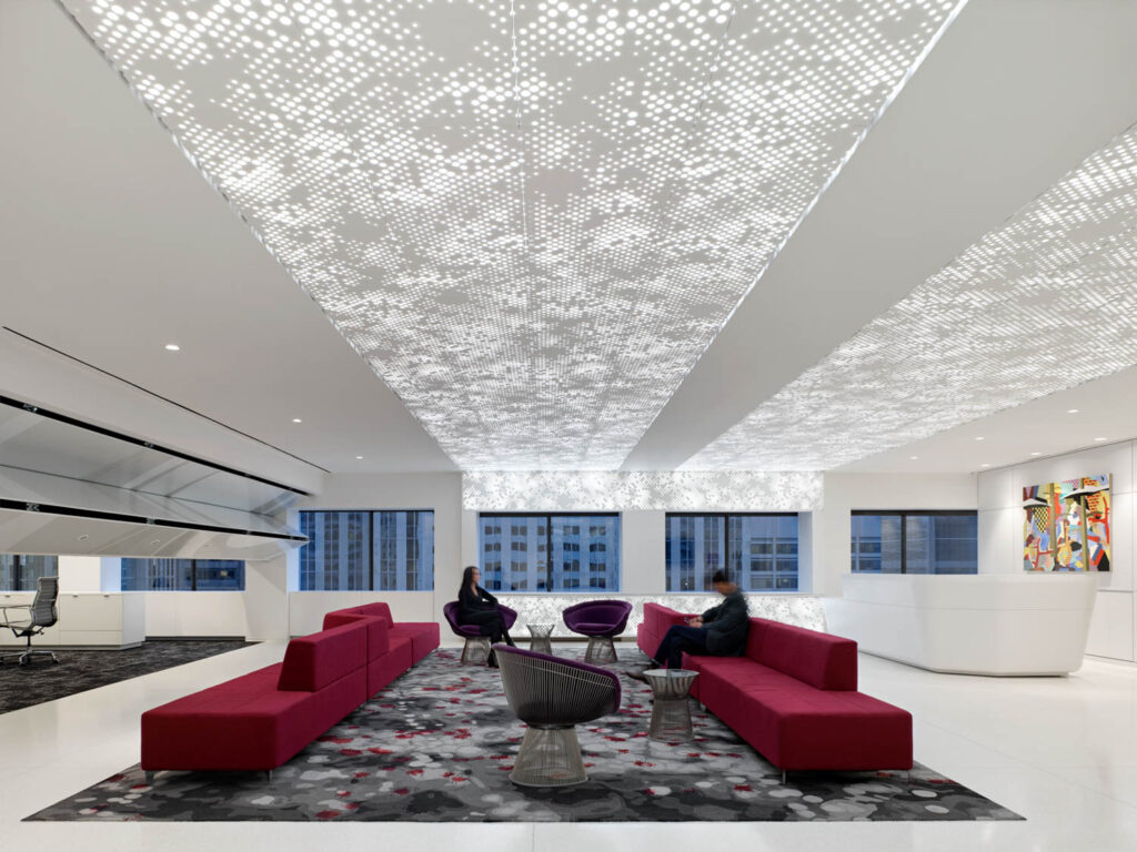 a reception area with a sporadically lit honeycomb ceiling