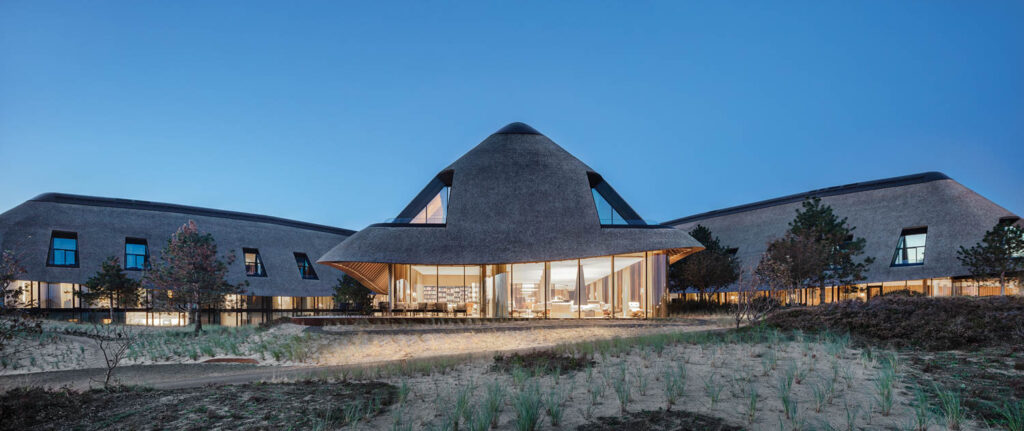 the exterior of a German spa lit up at night