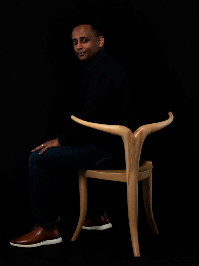 Jomo Tariku sitting in his Nyala chair