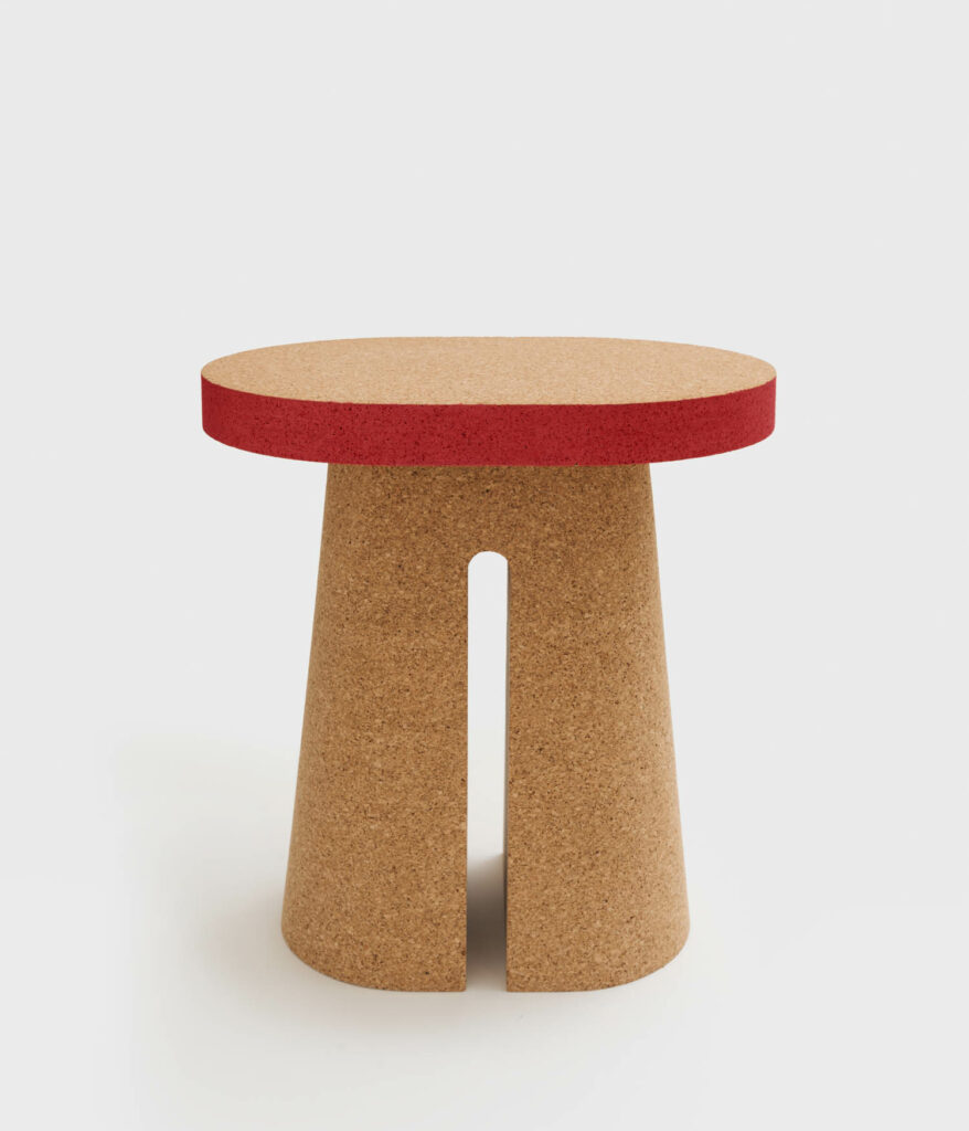 a side table with a red top and a cork base