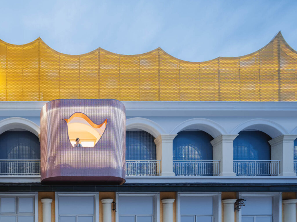 a bird cutout on an enclosed balcony of an animal-themed bookstore