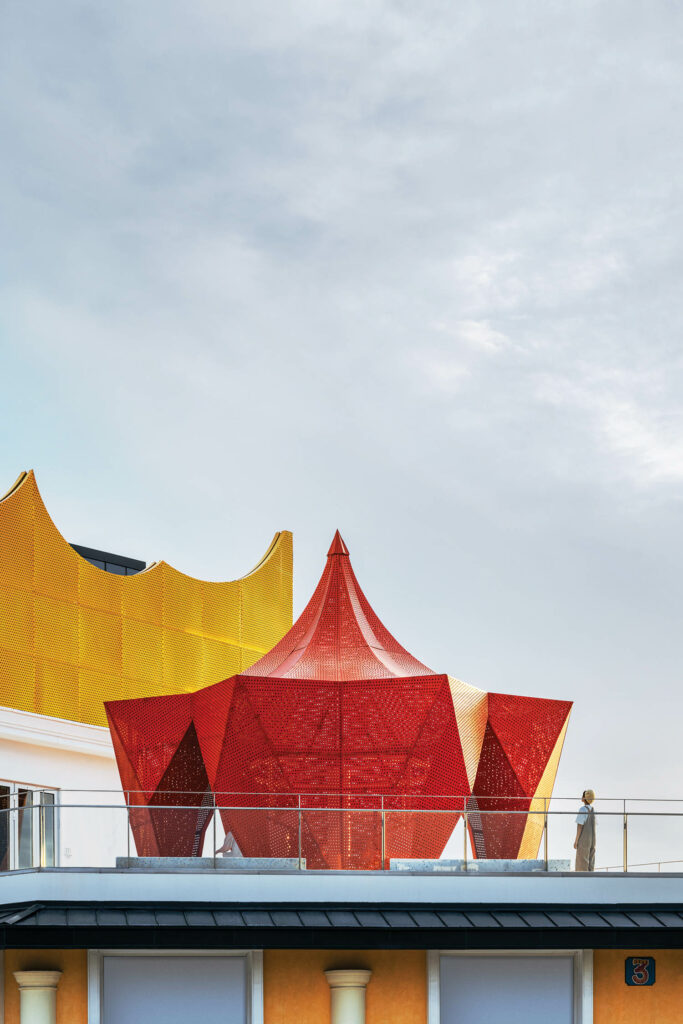 an aluminum tent forms a terrace at a bookstore