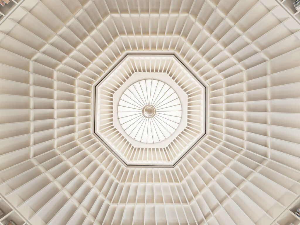 a skylight in the center of an octagonal shaped ceiling