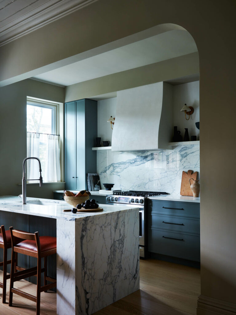 a marble island in the kitchen of a Brooklyn brownstone