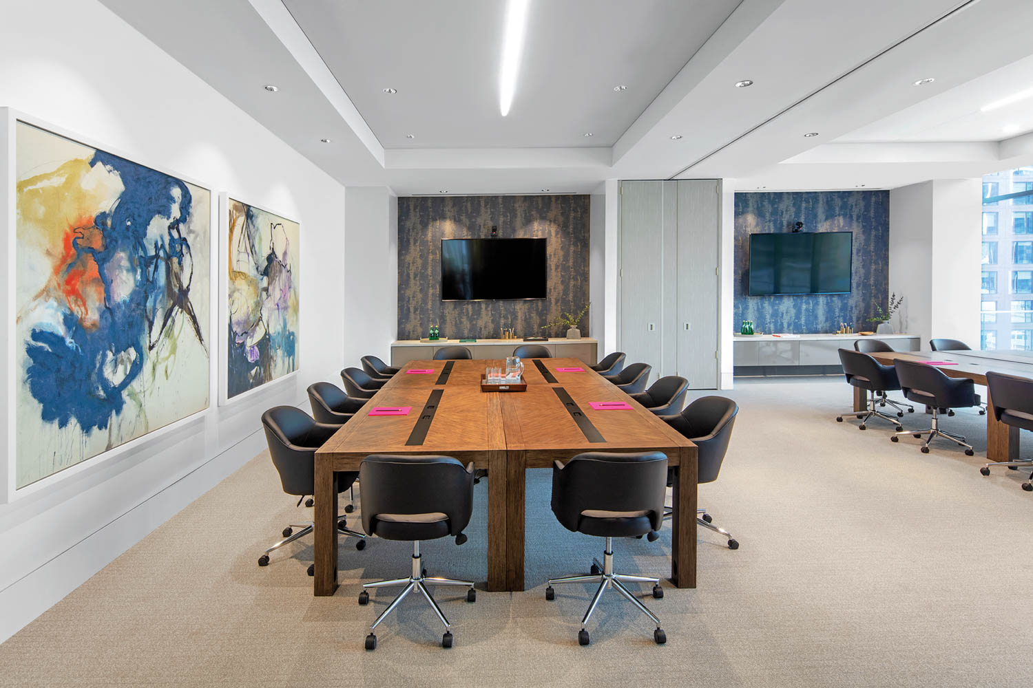 a conference room with large canvas prints on the wall