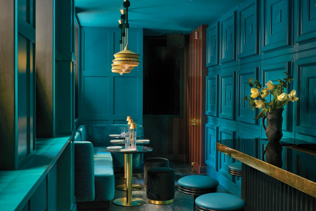 a teal lounge-like room in Andra Hem in Philadelphia