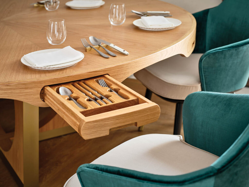 built-in cutlery drawers in a dining table