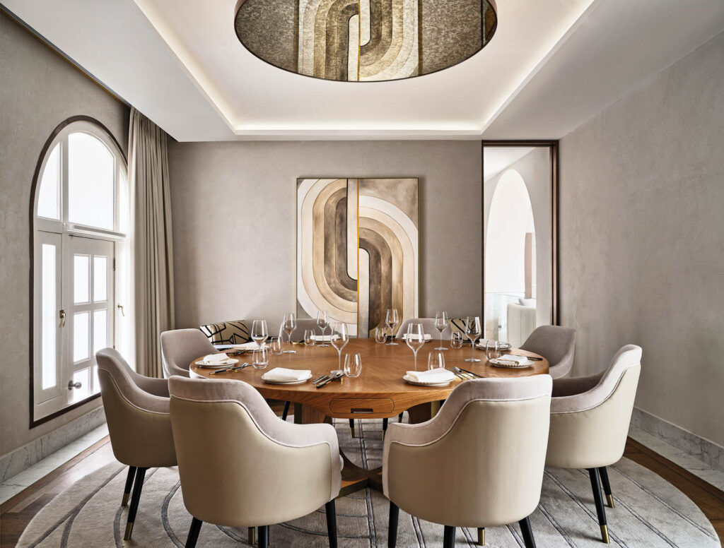 a private dining room in a restaurant with a mirrored ceiling insert that reflects an oil painting