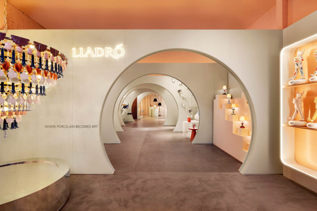 A circular cutout in the wall creates a path in the Lladró Concept Store in New York