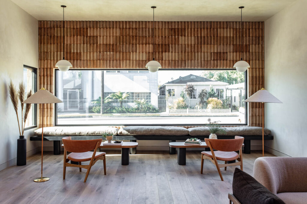 The interior of an office with ceramic brick wallcovering in terracotta hues