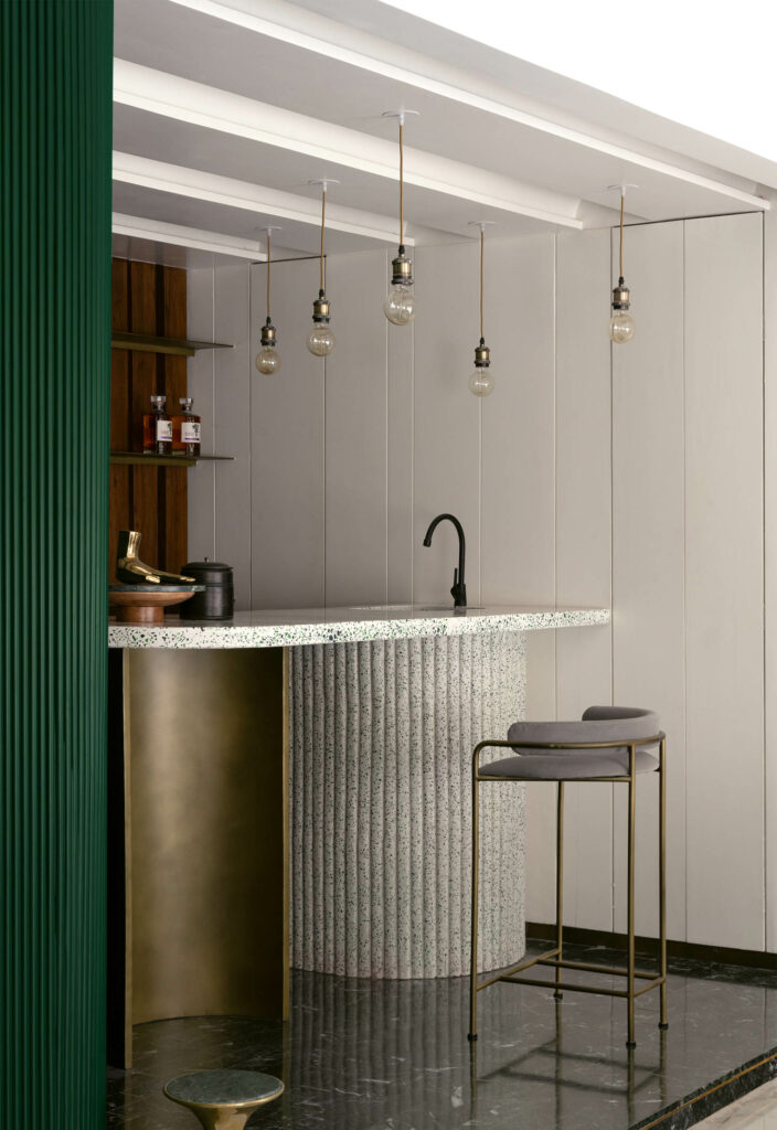 a terrazzo bar top with green glass chips in a Mumbai apartment