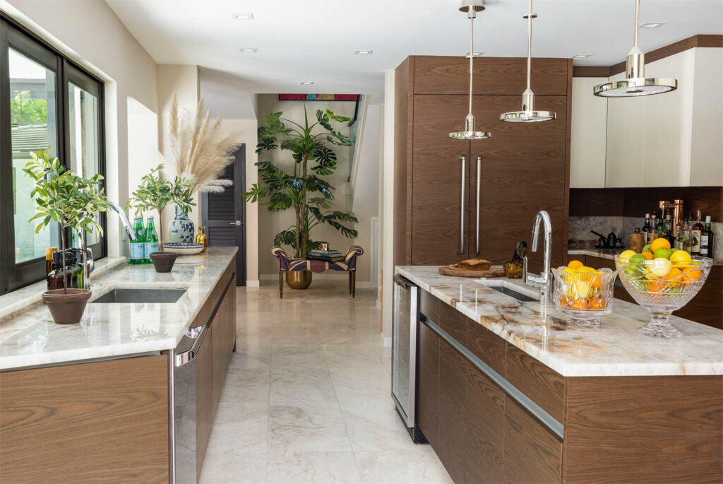 The kitchen of the home features a floor-to-ceiling palm tree