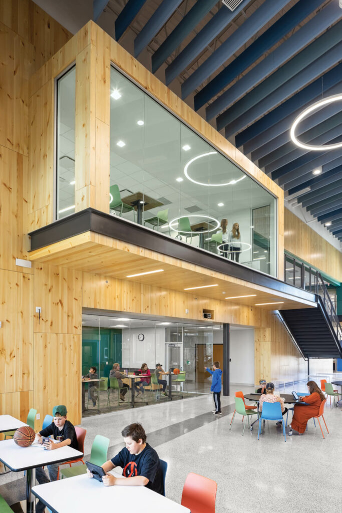 A wood paneled wall in Laurentian Elementary School overlooks the ground floor