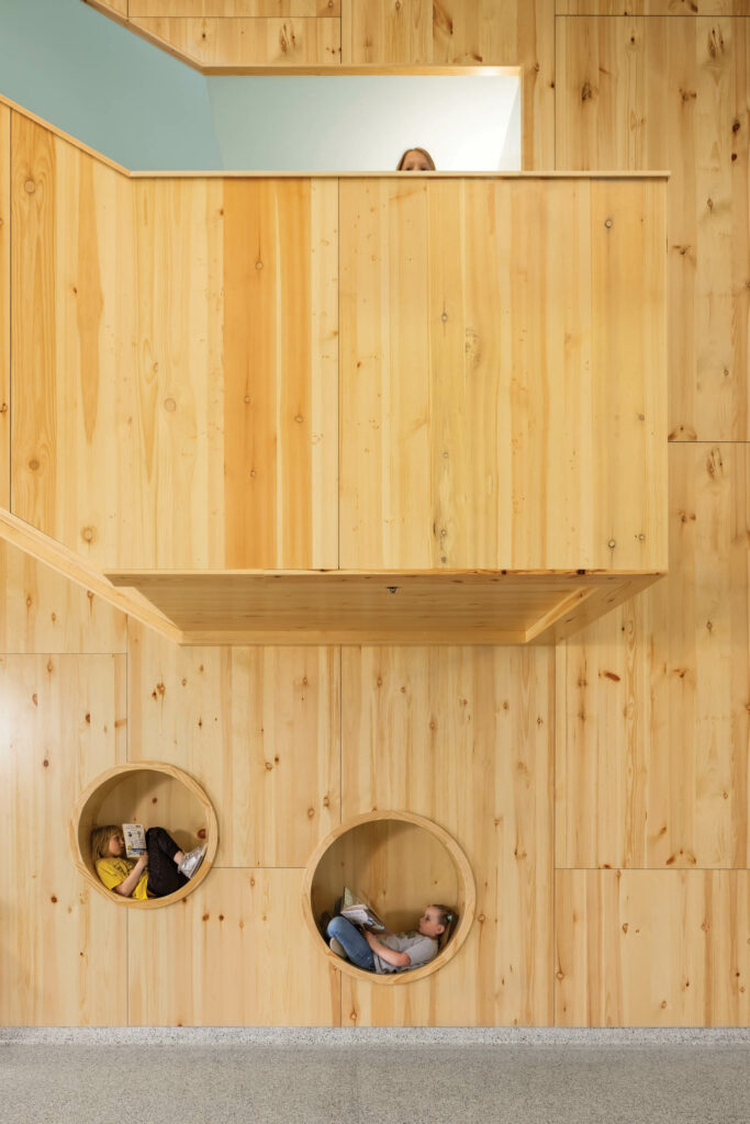 Circular cutouts offer children space to play in Laurentian Elementary School