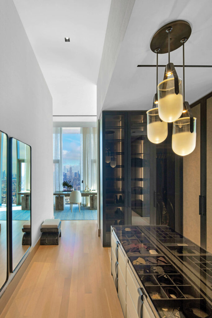 a desk is viewed through the open door of the closet in a New York apartment