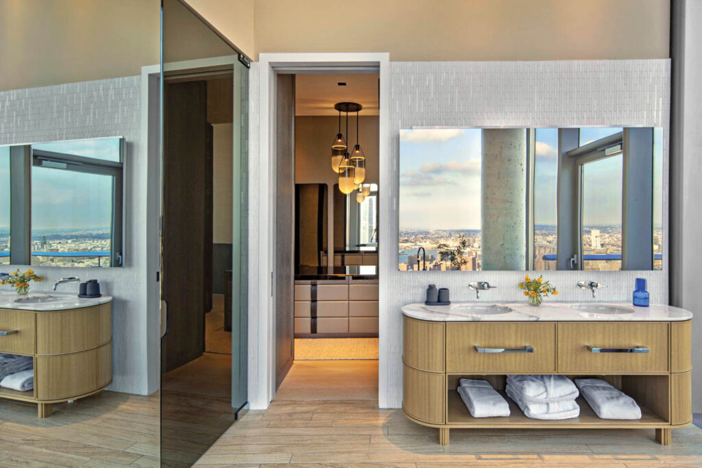 the main bathroom of an NYC penthouse apartment with a custom dual vanity