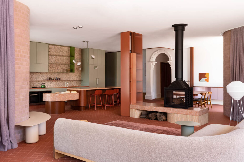 the living room of an Edwardian-era home with connecting with its kitchen