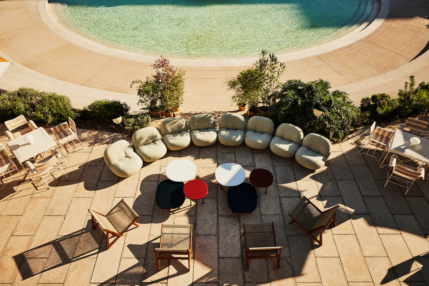 a group of seating next to the water at Milan Design Week