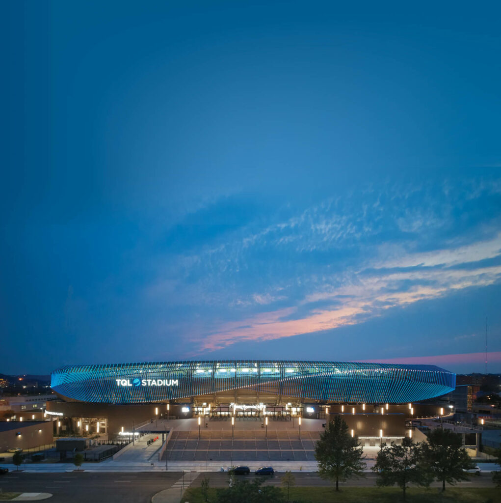 Exterior of the TQL Stadium at dusk