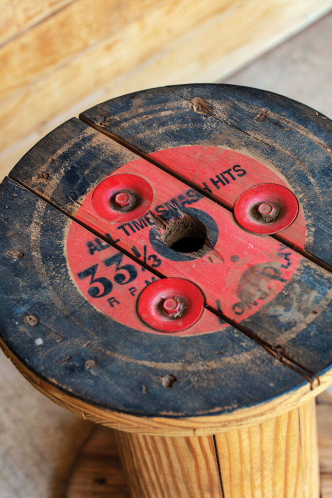 a spool table painted like a vinyl record