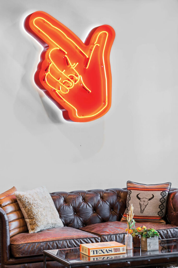 a neon Texas Tech Raiders logo in the presidential suite of Cotton Court Hotel