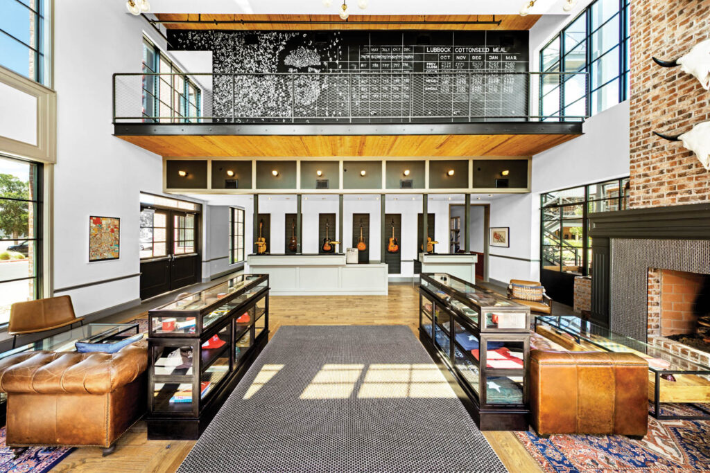 a mural of Buddy Holly overlooks the lobby of the Cotton Court Hotel