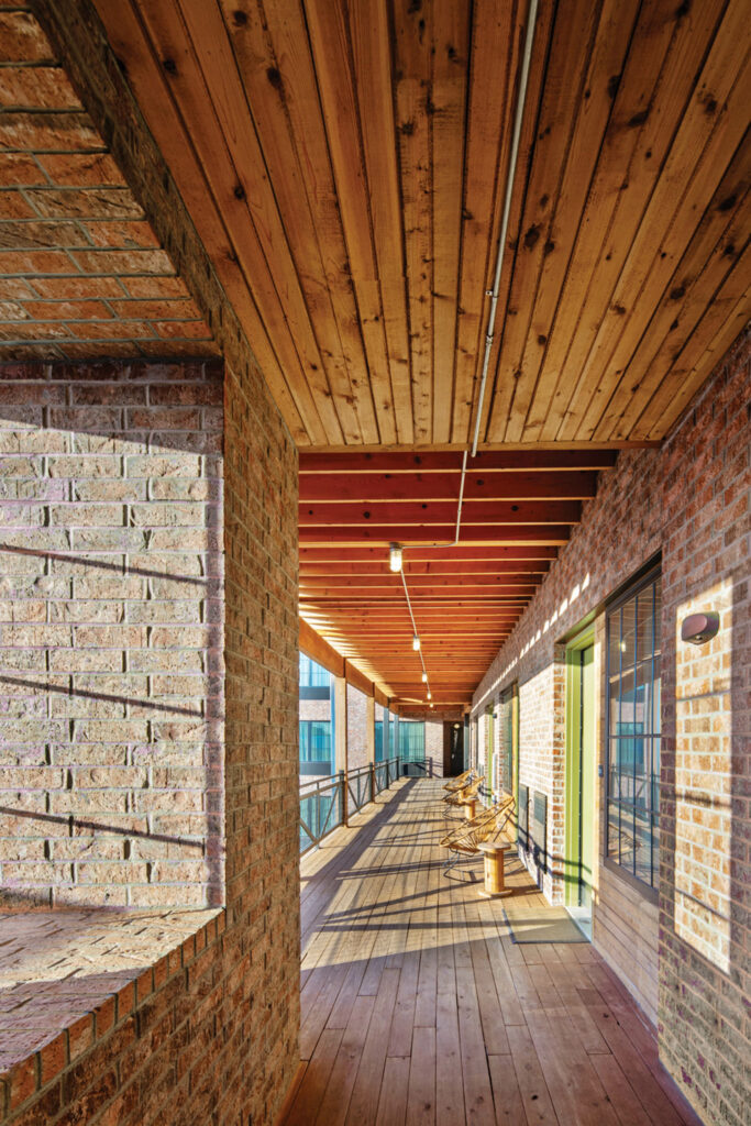 guest room corridors at the Cotton Court Hotel covered in yellow pine and Douglas fir