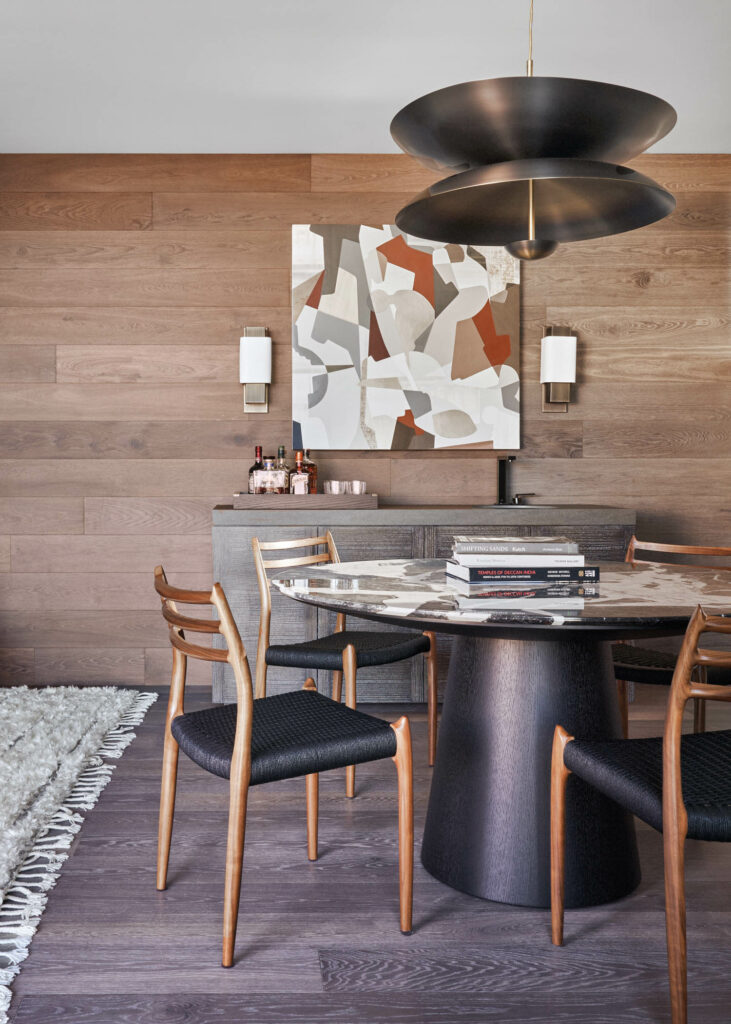 an Aaron Wexler painting hangs above a UFO table in this California penthouse