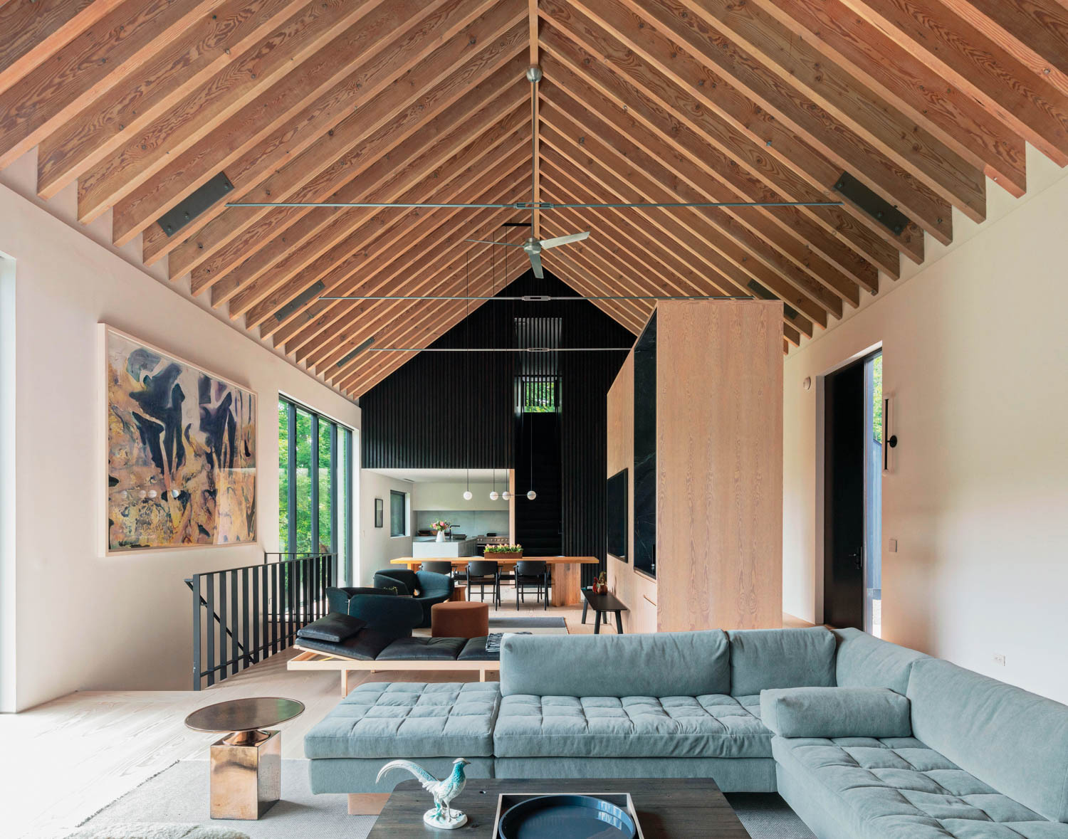 a blue modular sofa in a renovated dairy barn