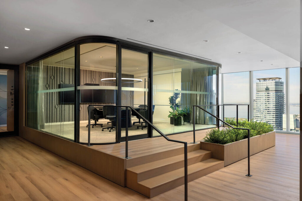 a raised meeting room enclosed in glass