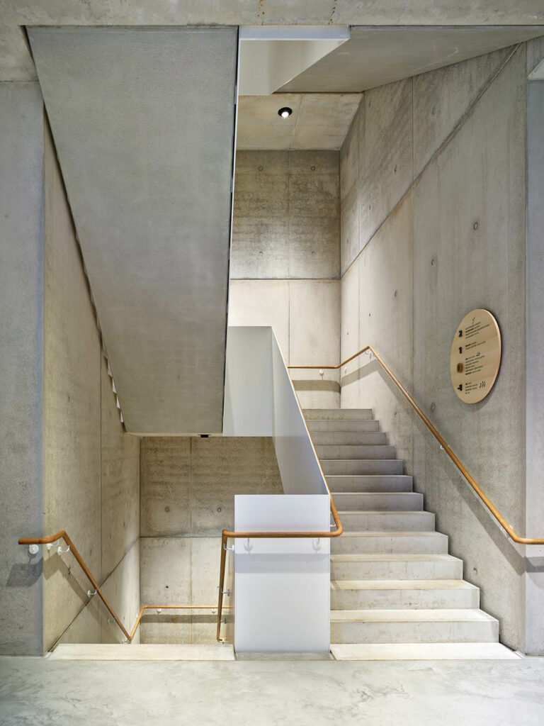 an interior staircase in concrete inside Rapunzel World