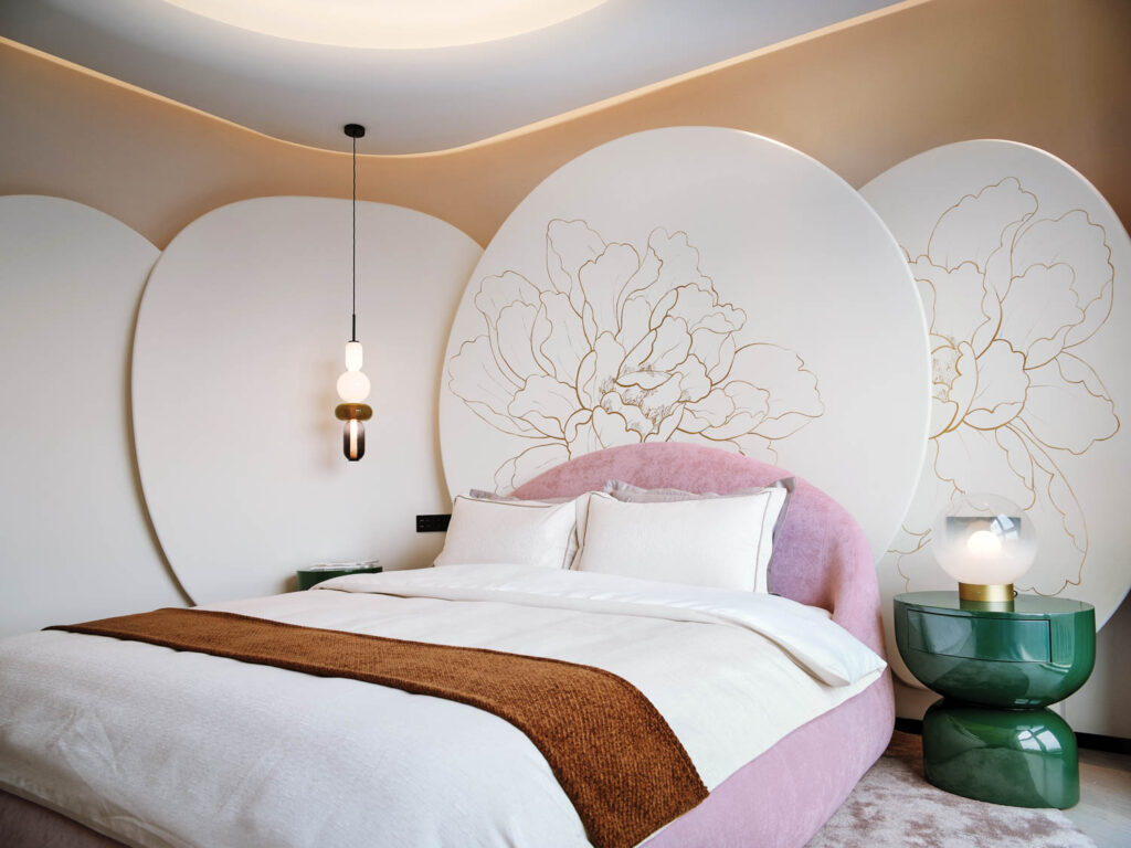 floral motifs hang above a pink bed and green night stand